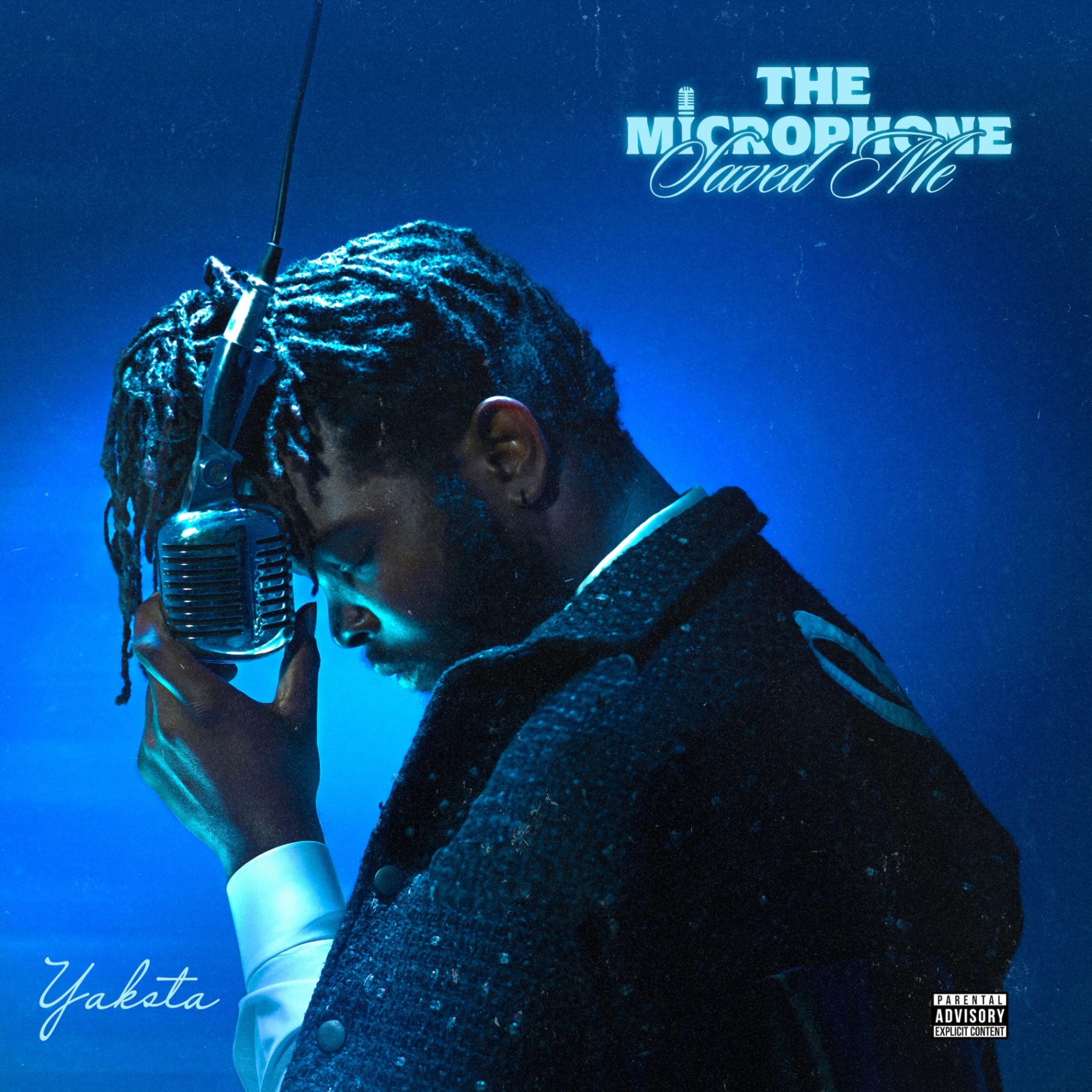 Album cover for The Microphone Saved Me by Yaksta — a singer holding a vintage microphone in deep blue light